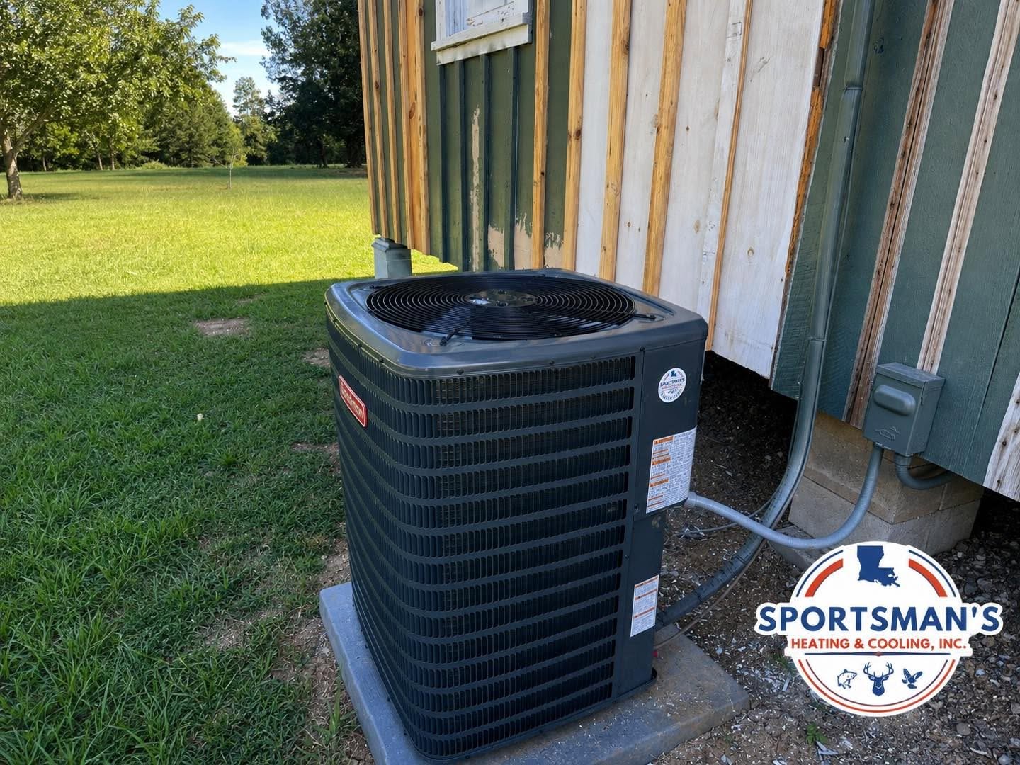 Outdoor heating and cooling equipment at a home served by Sportsman's Heating and Cooling, Inc.