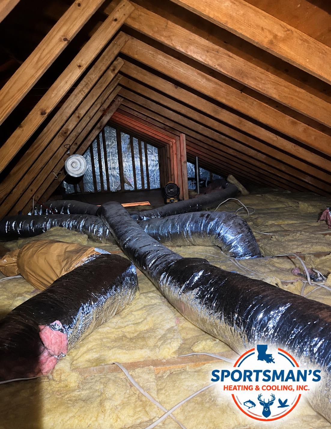 Insulated air ducts running through an attic